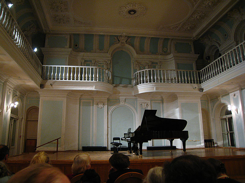 The recital was exceptionally long and the first pianist was absurd. She was amazingly full of herself, and I couldn't help laughing as she repeatedly kept staring at the ceiling during the performance puckering her lips or something. To top it off her playing wasn't that great either.