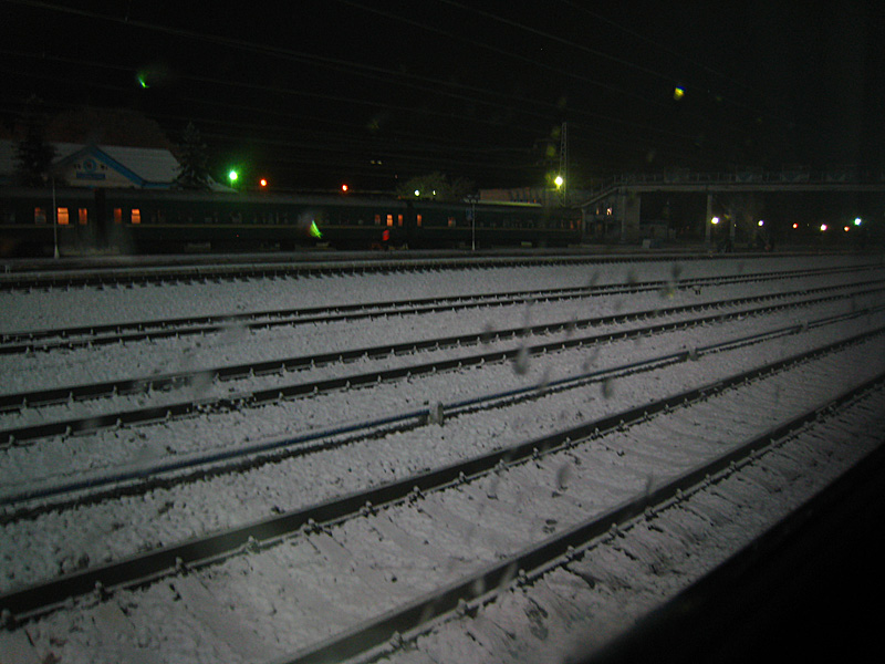 I'm awake in the middle of the night on a train in the middle of nowhere. But at least there's snow!
